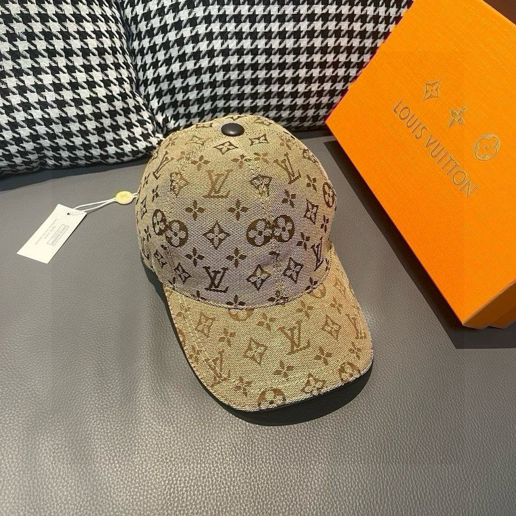 Tan monogram baseball cap with curved brim and top button