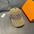 Tan monogram baseball cap with curved brim and top button