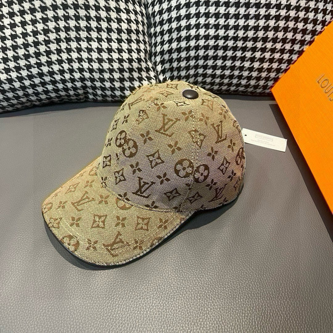 Tan monogram baseball cap with curved brim and front logo pattern