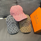 Set of three Louis Vuitton monogram caps: pink, black, and beige