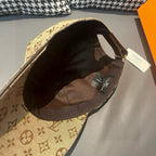 Tan monogram baseball cap interior viewed from the underside of the brim