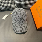 Louis Vuitton cap in light gray with black monogram pattern, curved brim