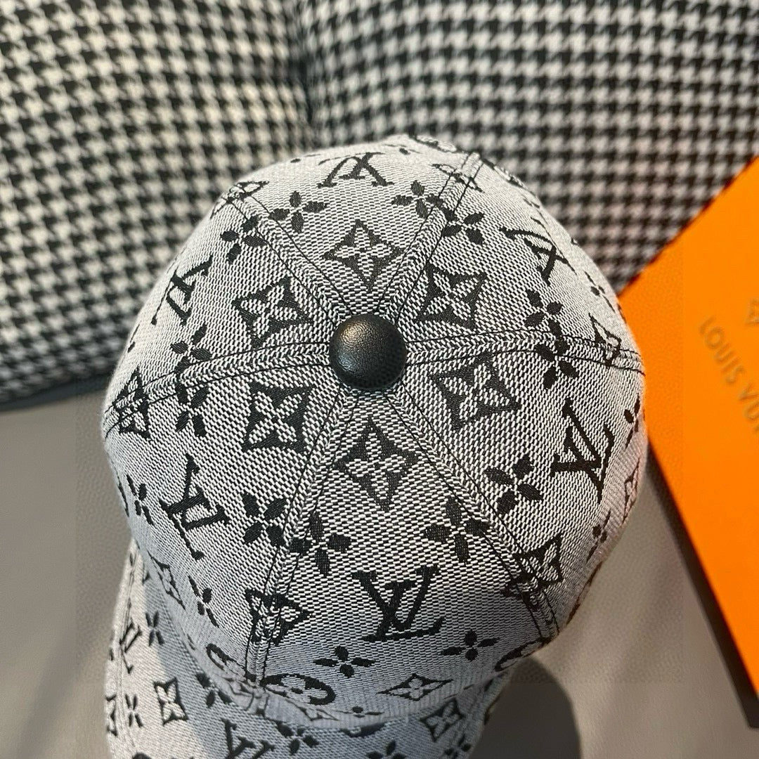 Louis Vuitton cap top in light gray with black monogram pattern and button