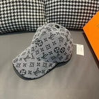 Louis Vuitton cap in light gray with black monogram pattern, front-left view