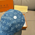 Louis Vuitton blue denim cap with white top button and allover monogram print