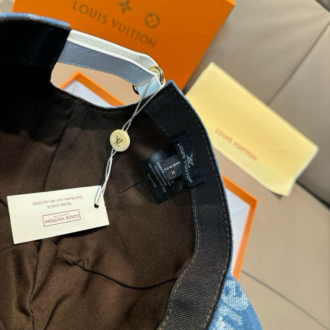 Louis Vuitton cap view with white strap, black webbing band, and hanging tags