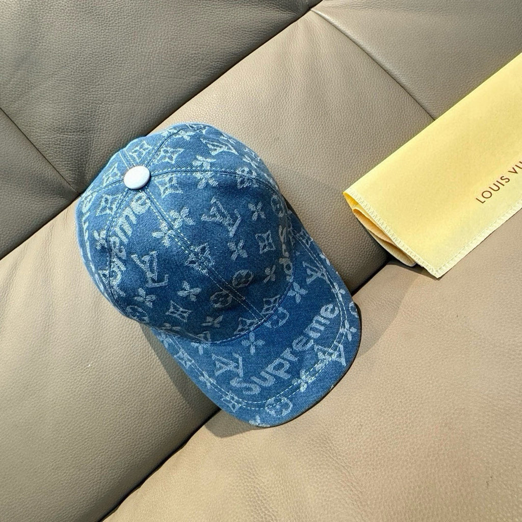 Louis Vuitton blue denim baseball cap with white button and repeating monogram print