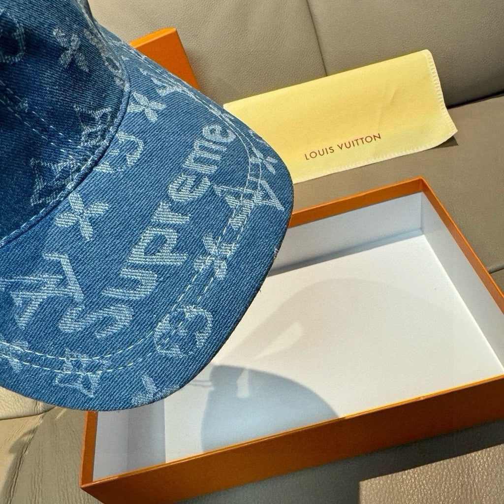 Louis Vuitton blue denim cap close-up: monogram print on the curved crown