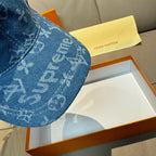 Louis Vuitton blue denim cap close-up: monogram print on the curved crown