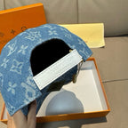 Louis Vuitton blue denim cap with white leather strap and side logo patch