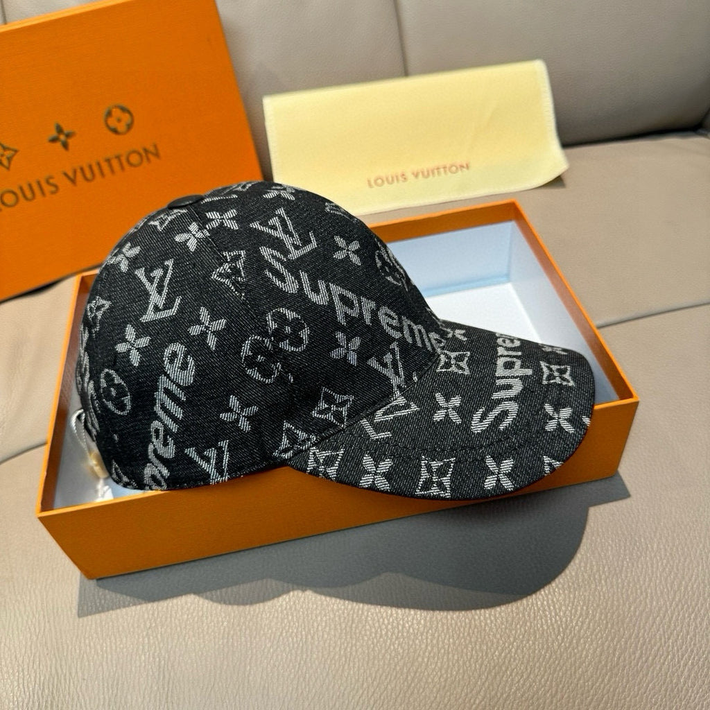 Black monogram cap with Supreme lettering, curved brim, side view.