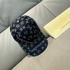 Black monogram cap with Supreme text, buttoned crown, curved brim.