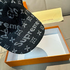 Black monogram cap side view with repeating icon pattern.