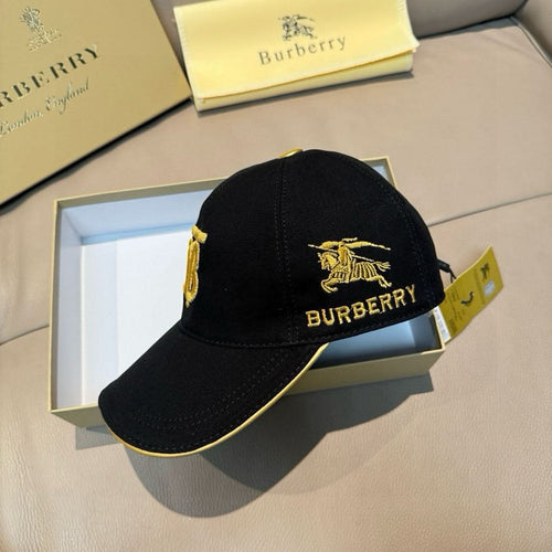 Burberry cap in black with gold horse emblem and "BURBERRY" text on front.