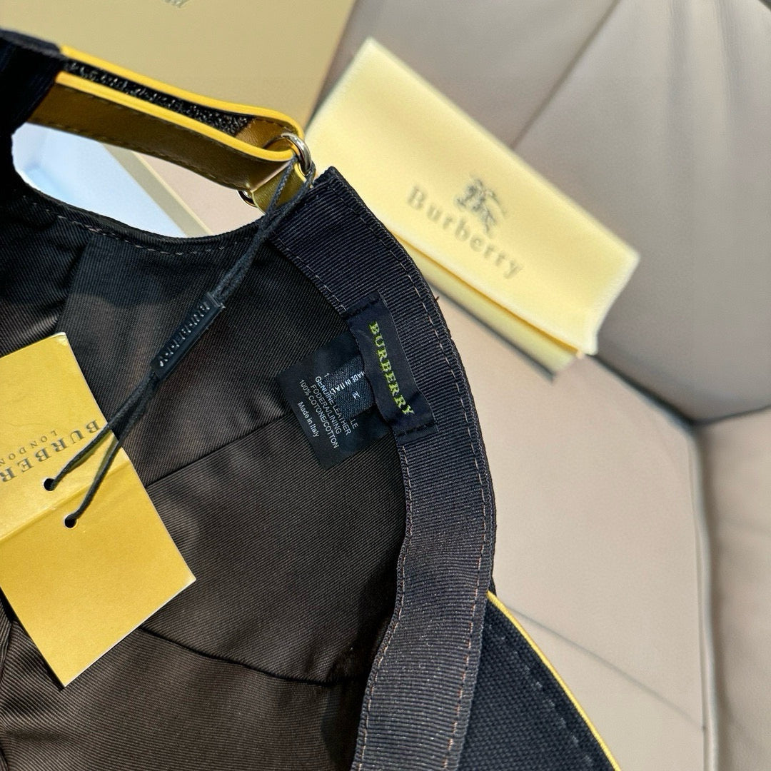 Burberry cap interior showing black fabric panel, label, and adjustable strap.
