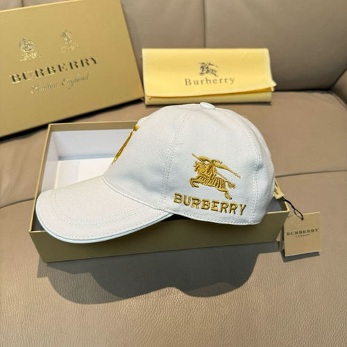 White Burberry baseball cap with gold horse emblem and BURBERRY logo