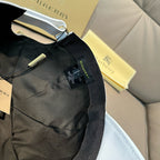 Black Burberry cap interior with adjustable strap and hanging label