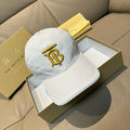 White Burberry baseball cap with gold B monogram embroidery on front