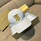 White Burberry baseball cap with gold B monogram embroidery on front