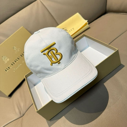 White Burberry baseball cap with gold B monogram embroidery on front