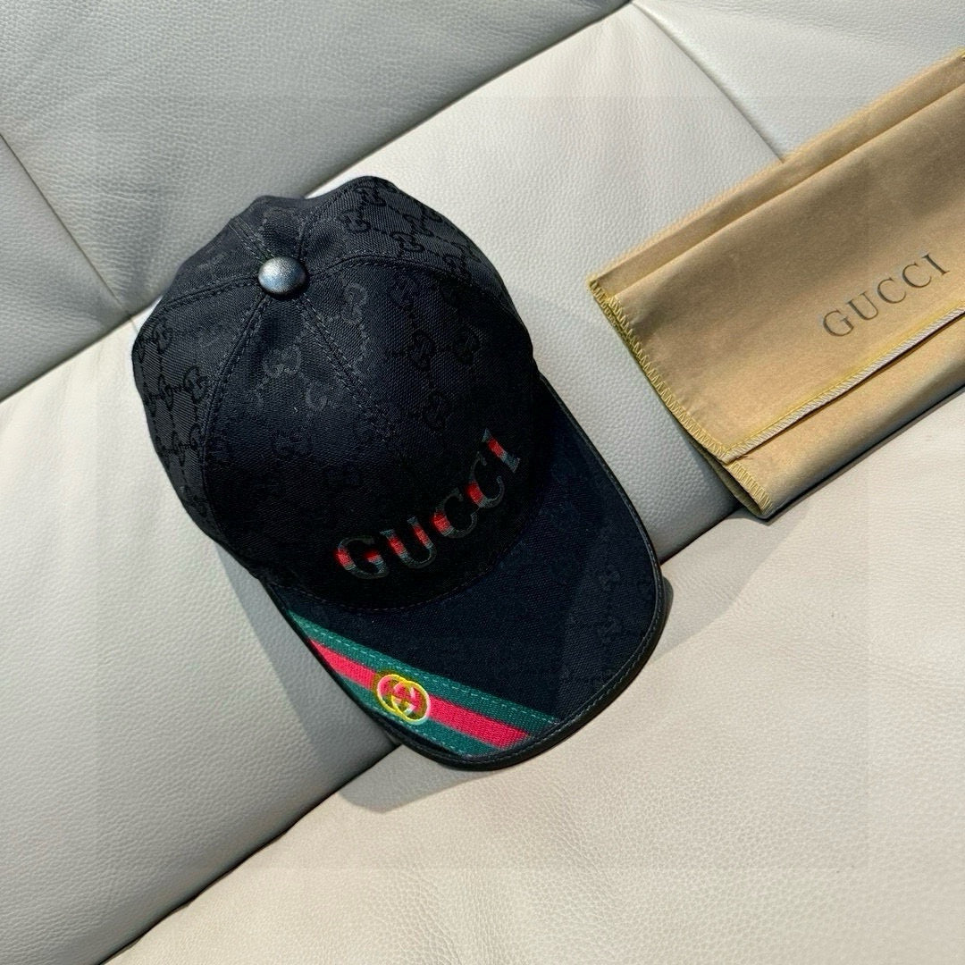 Black Gucci baseball cap with GG monogram, red logo lettering, and web stripe