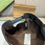 Black Gucci cap inside view with adjustable strap and hanging product tags