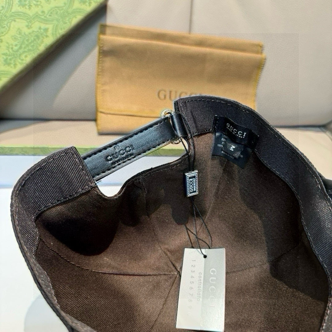 Black Gucci cap inside view with adjustable strap and hanging product tags