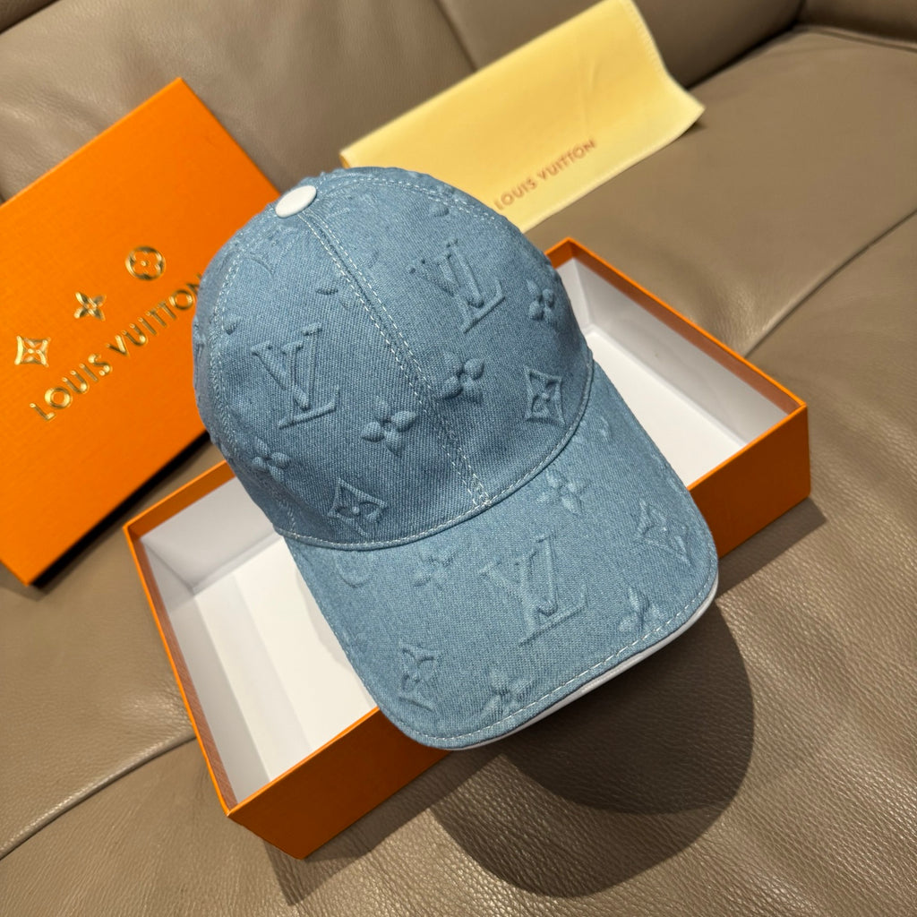 Blue denim monogram baseball cap with curved brim and stitched seams
