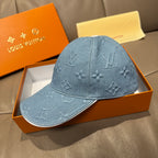 Blue denim monogram baseball cap, side view with curved brim