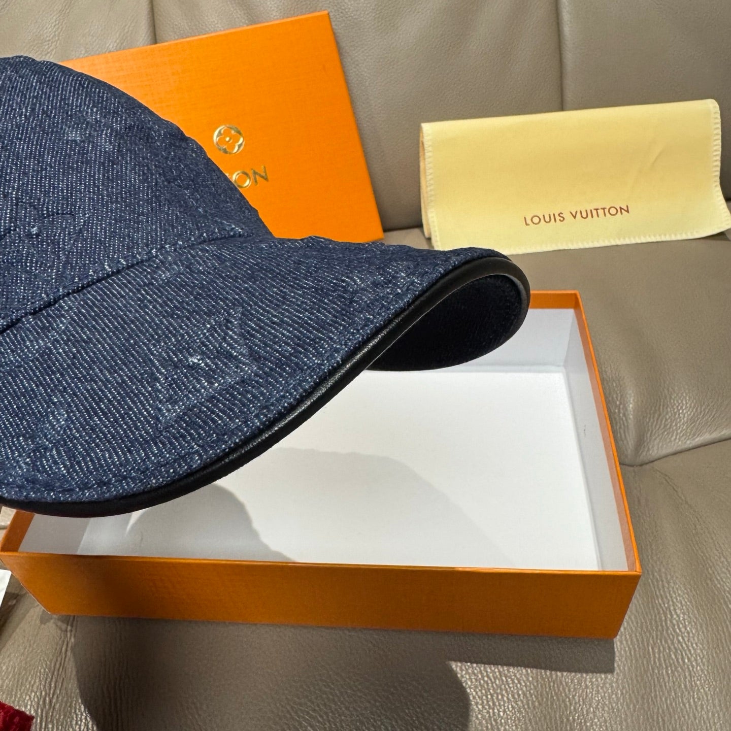 Louis Vuitton denim monogram baseball cap, dark navy blue, close-up of brim edge