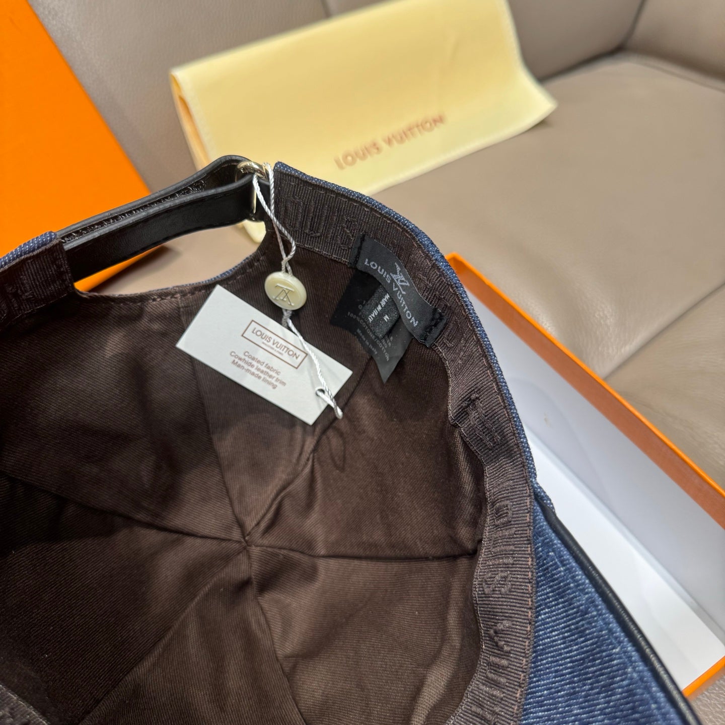 Louis Vuitton denim baseball cap interior with adjustable strap and hanging tags