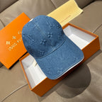Blue denim cap with embossed LV monogram pattern and curved brim