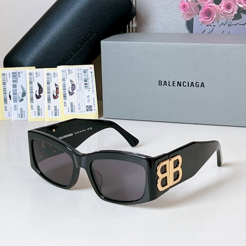 Black square sunglasses with dark lenses and gold EB logo temples