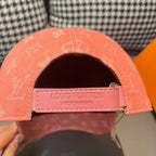 Louis Vuitton monogram cap in coral pink, front strap with LV label and metal buckle