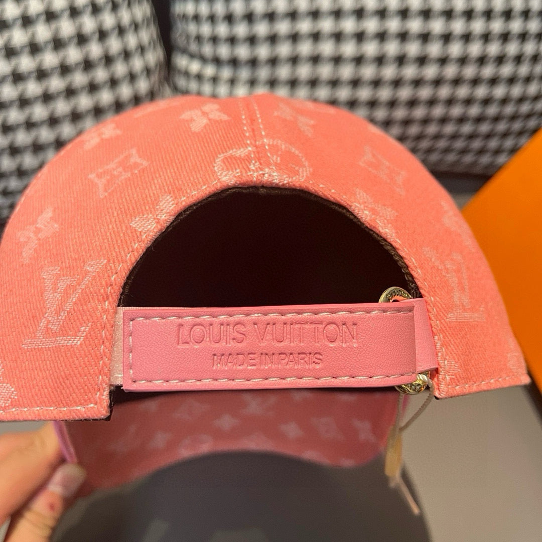 Louis Vuitton monogram cap in coral pink, front strap with LV label and metal buckle