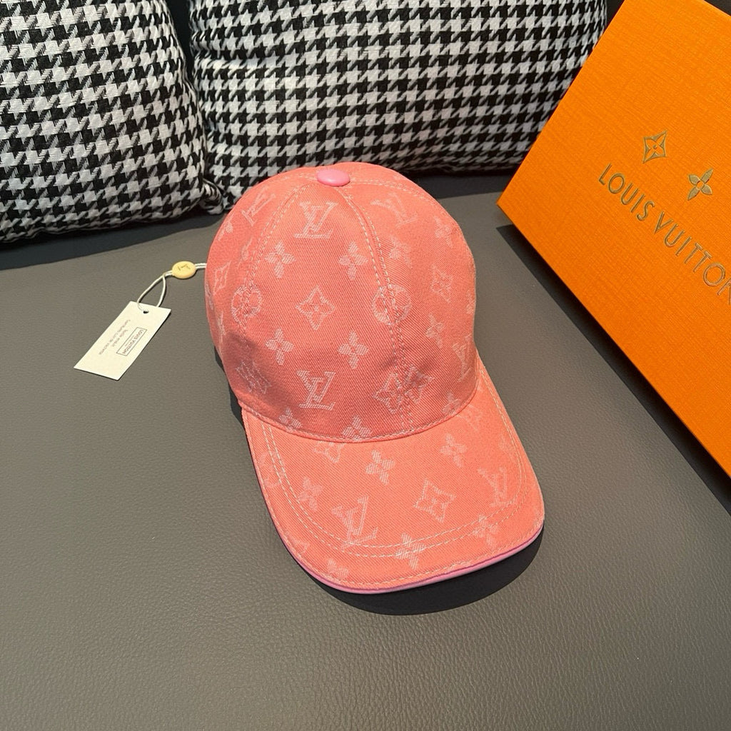 Louis Vuitton monogram cap in coral pink, side view with allover LV-style pattern