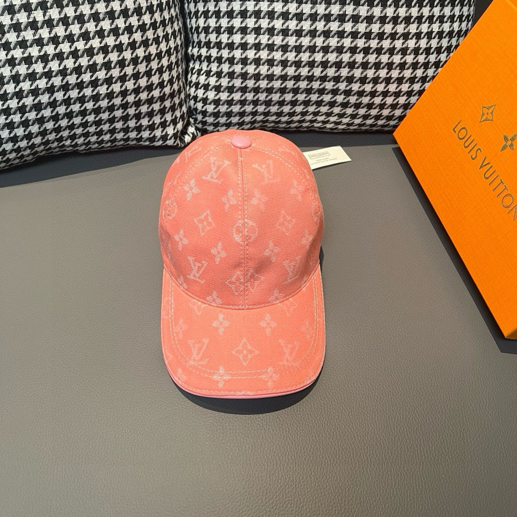 Louis Vuitton monogram cap in coral pink, front view with curved brim and panel seam