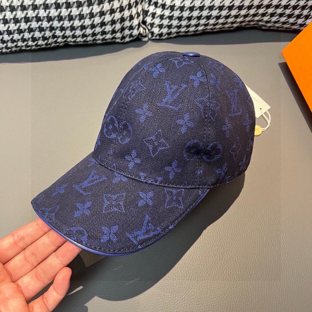 Louis Vuitton monogram baseball cap in dark blue, curved brim and front emblem detail