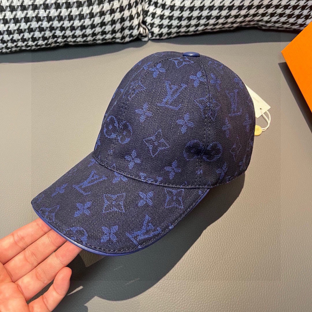 Louis Vuitton monogram baseball cap in dark blue, curved brim and front emblem detail