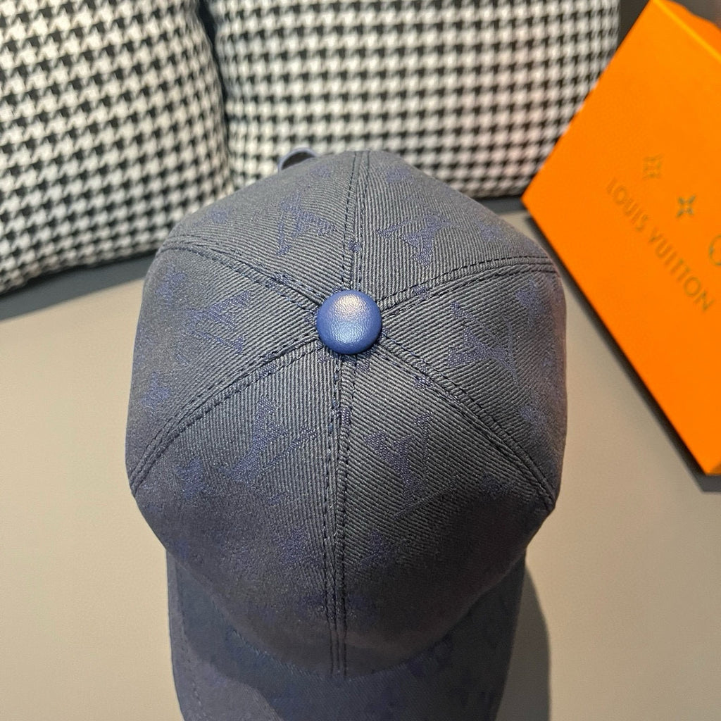 Louis Vuitton monogram denim cap in navy blue, domed crown with blue button