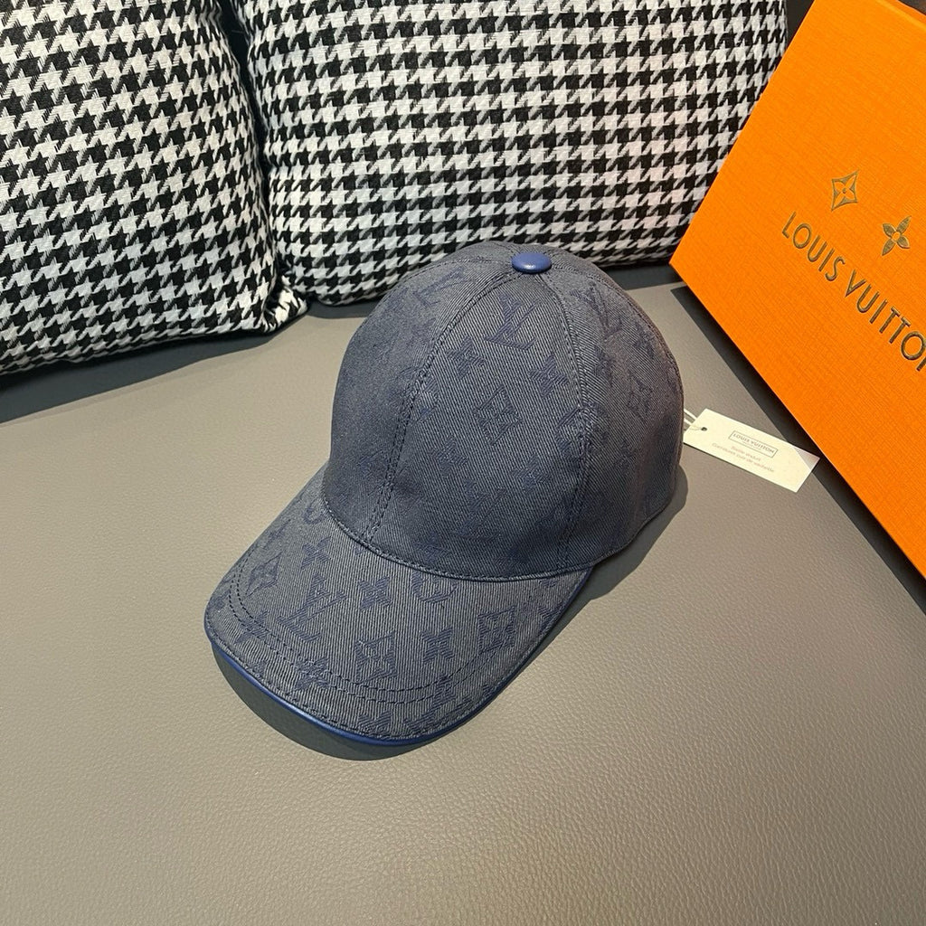 Louis Vuitton monogram denim cap in navy blue, with blue button and embossed LV pattern