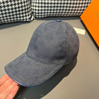Louis Vuitton monogram denim cap in navy blue, curved brim and textured LV pattern