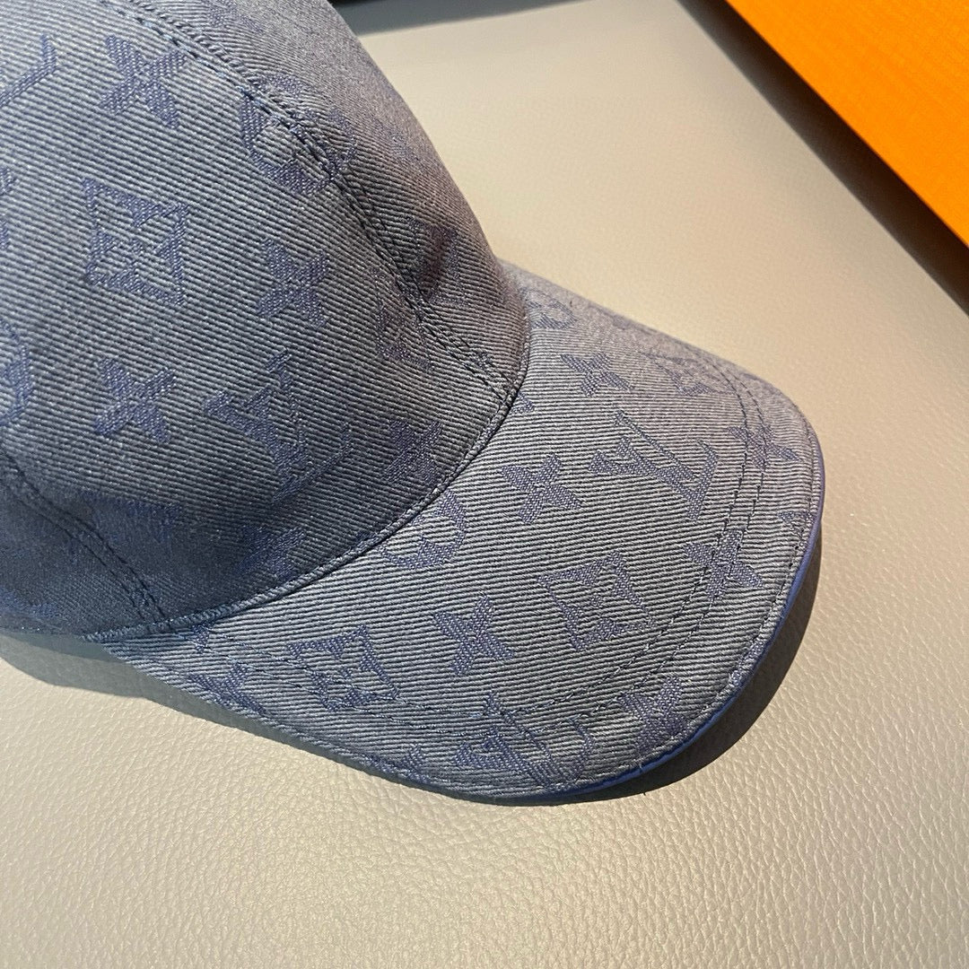 Louis Vuitton monogram denim cap in navy blue, textured LV pattern on brim
