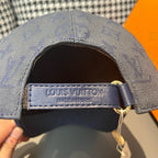 Louis Vuitton monogram cap label and adjustable strap with gold buckle on navy cap