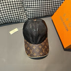 Black baseball cap with monogram print and contrasting brown logo brim