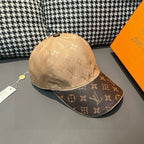 Beige and dark brown monogram baseball cap, angled front view