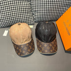 Pair of monogram baseball caps, beige and black with dark logo brims