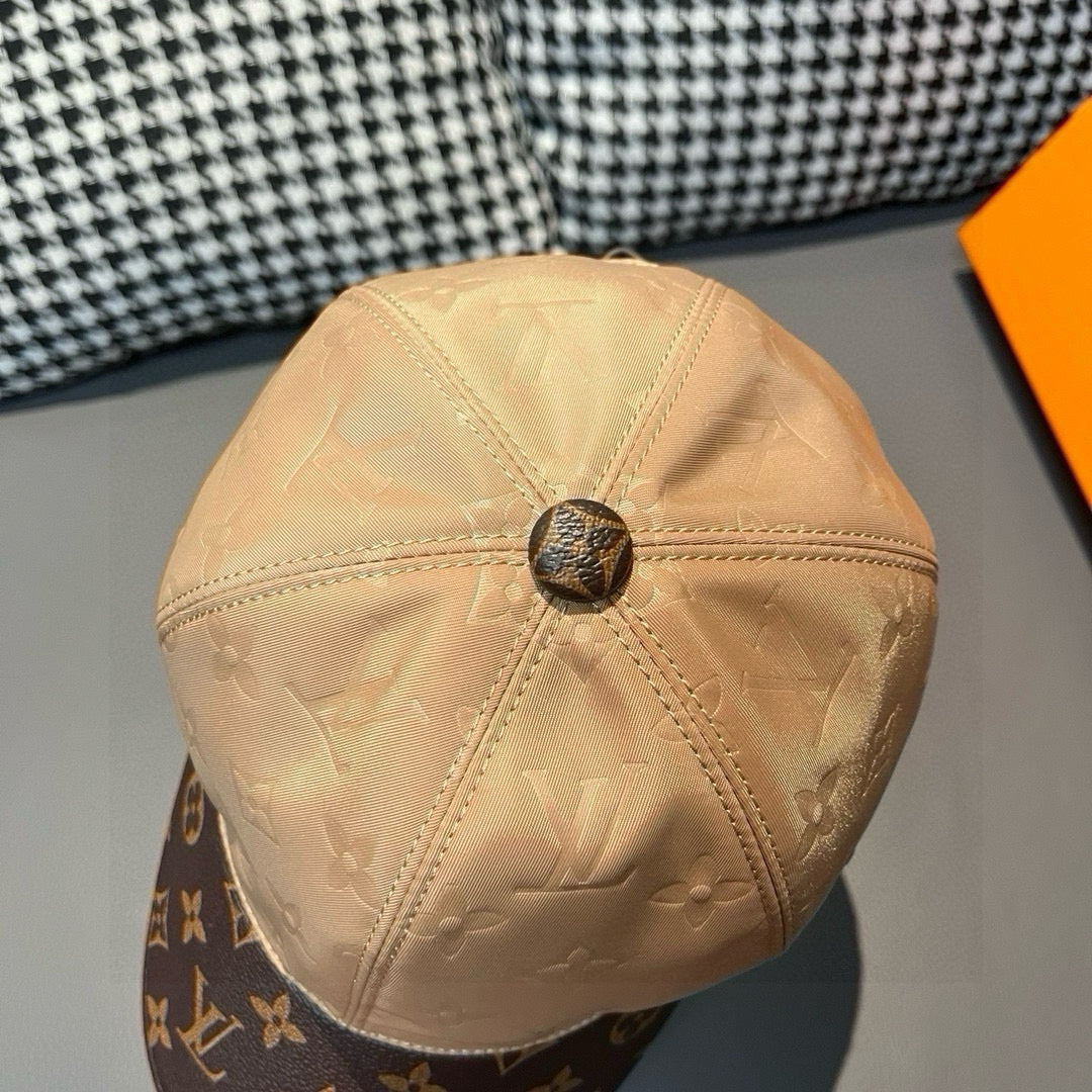 Beige monogram baseball cap top view with center button detail