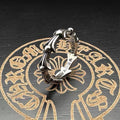 Chrome cuff ring with silver-toned horseshoe accents and engraved band