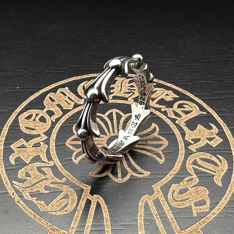 Chrome cuff ring with silver-toned horseshoe accents and engraved band